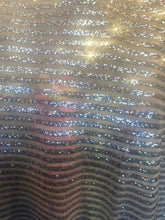 Load image into Gallery viewer, Striped sequin fabric with Mesh silver stretches for all 4 sides in silver sold by the yard
