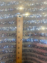 Load image into Gallery viewer, Striped sequin fabric with Mesh silver stretches for all 4 sides in silver sold by the yard
