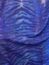 Load and play video in Gallery viewer, iridescent Hologram R/blue tiger design spandex stretch for all 4 sides 58/60 wide sold by the yard
