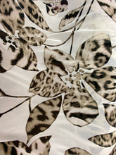 Load image into Gallery viewer, Leopard print leaves and flowers design Mesh fabric stretches on both sides and is sold by the yard black/tan
